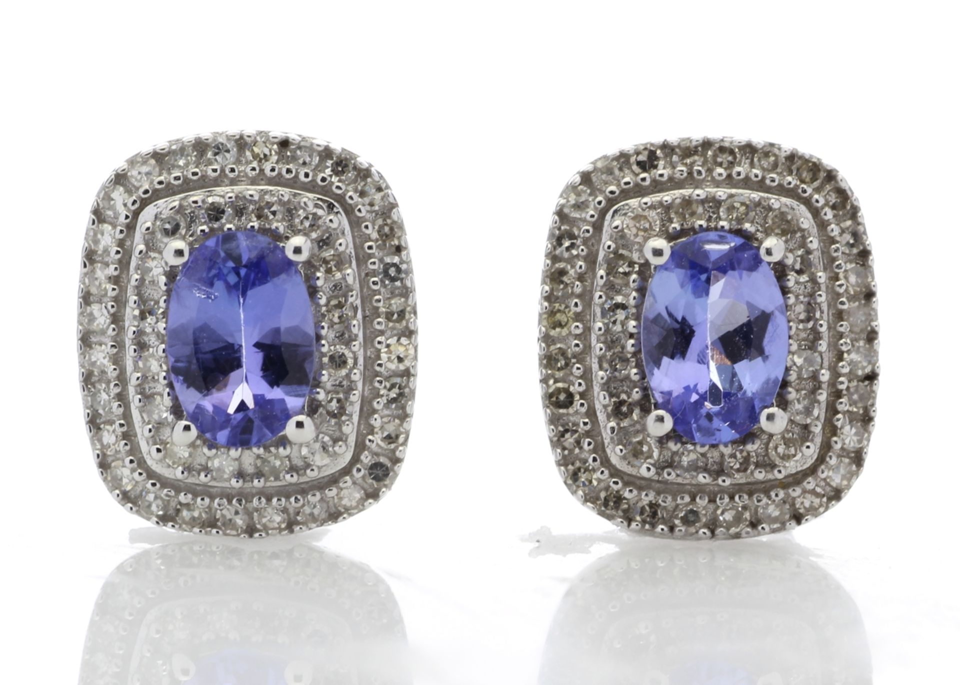 0.80ct tanzanite and diamond cluster stud earrings. 2 oval cut tanzanites surrounded with