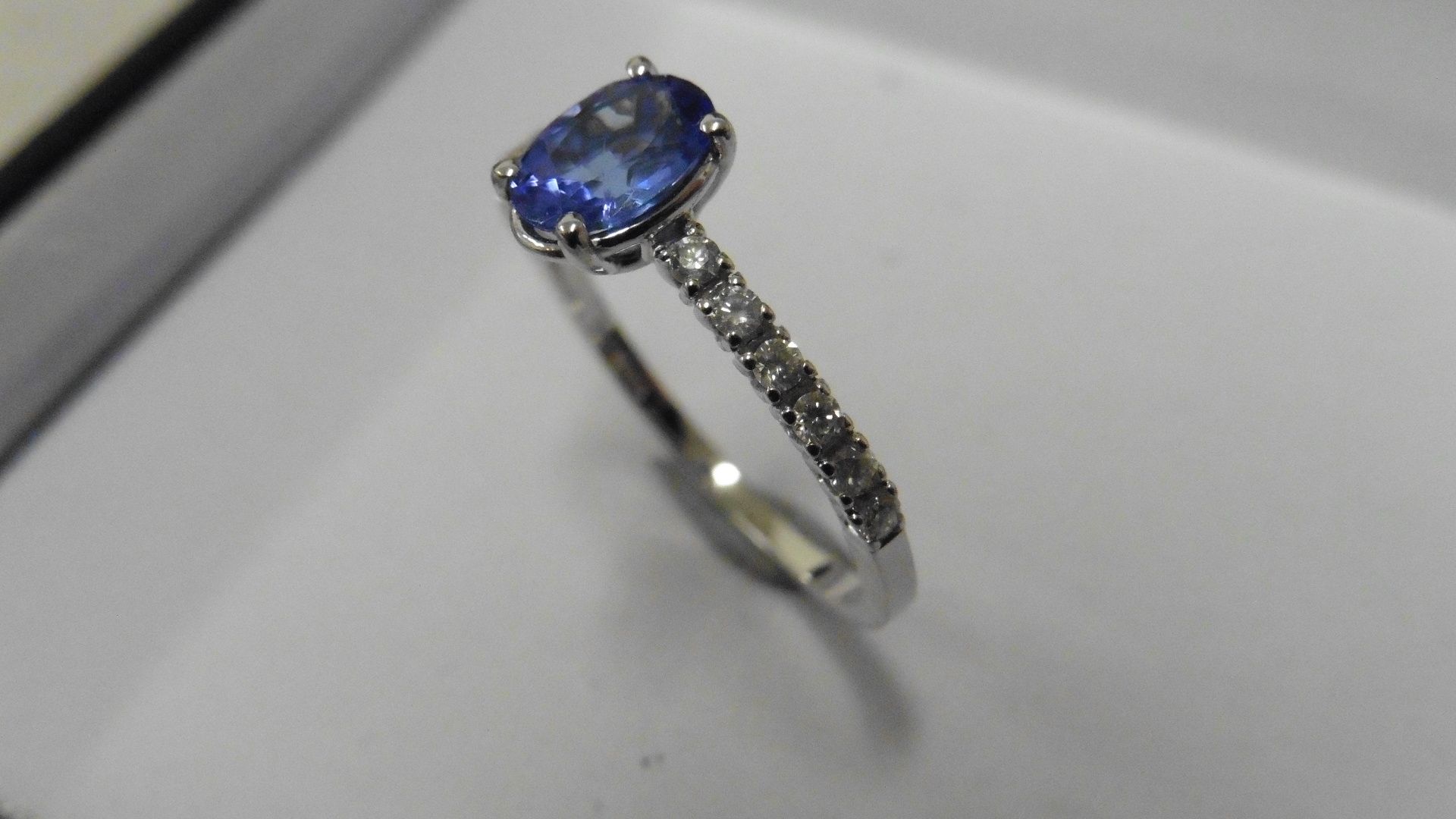 0.80ct / 0.12ct tanzanite and diamond dress ring. Oval cut ( treated ) tanzanite with small diamonds - Image 2 of 3