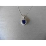 0.80ct sapphire and diamond cluster style pendant. ÊOval cut ( glass filled ) treated sapphire