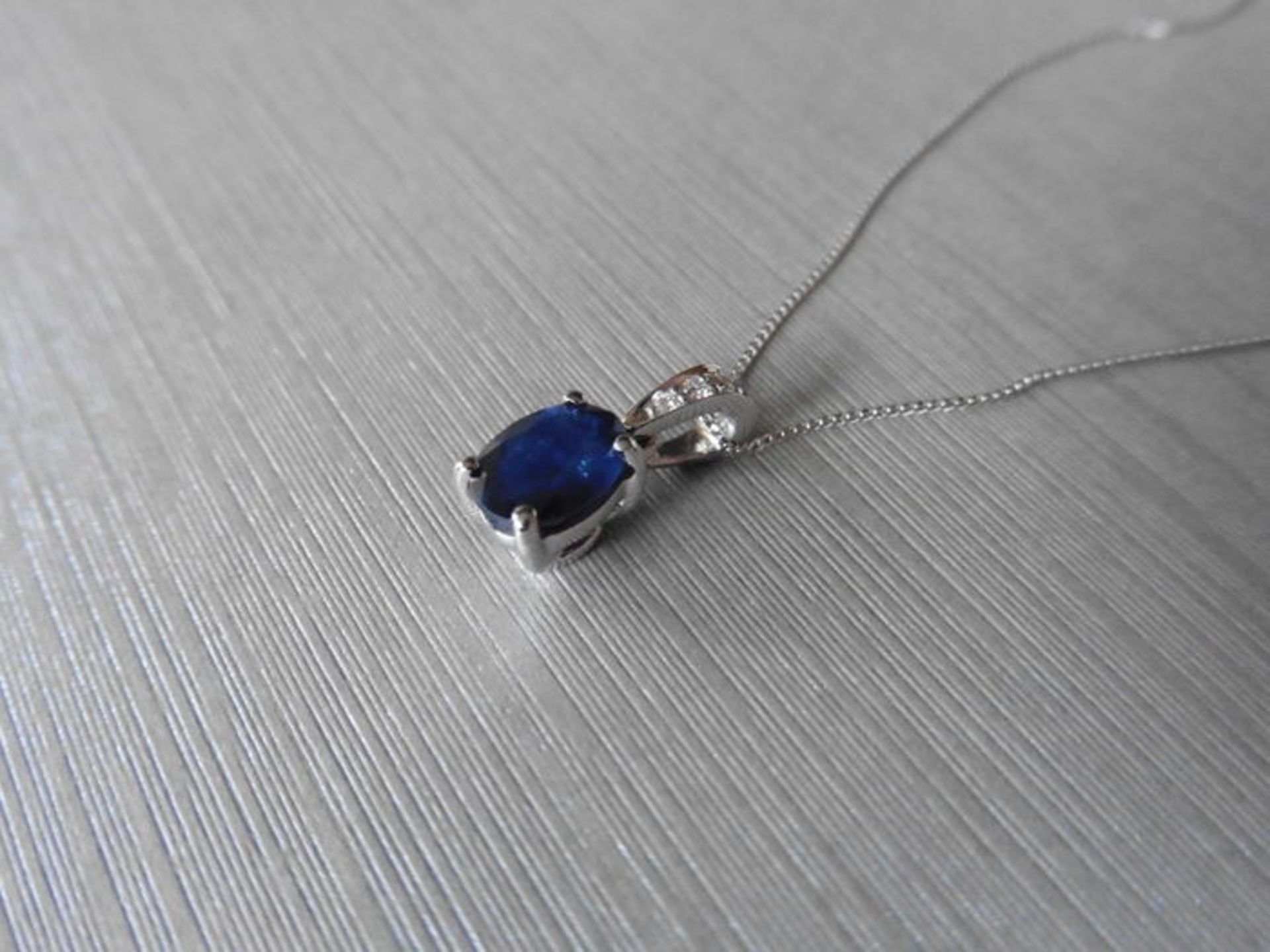 1ct sapphire and diamond pendant with an 7x5mm oval cut sapphire ( fracture treated ) and a - Image 2 of 3