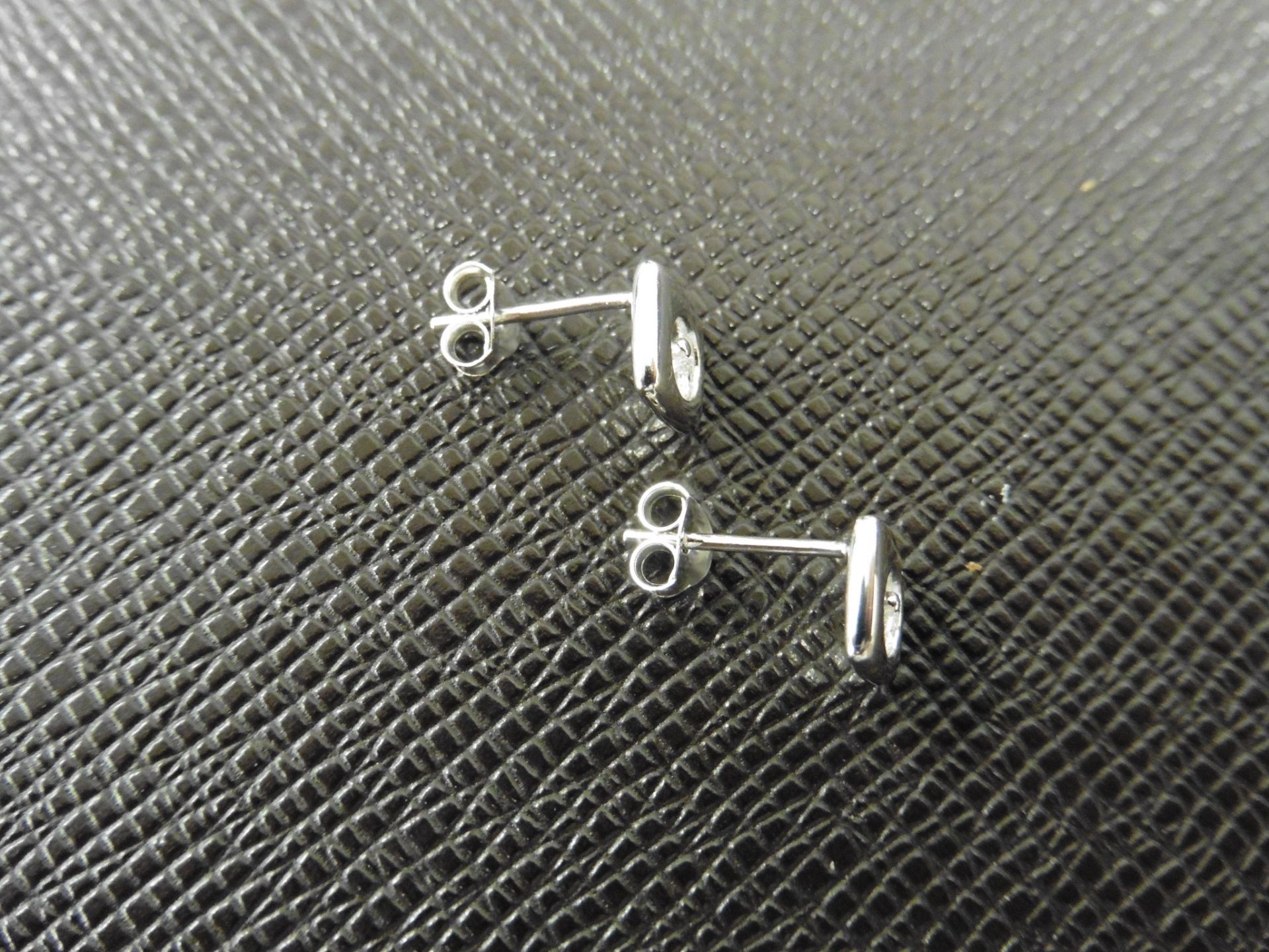 0.10ct diamond earrings set in platinum 950. 2 small brilliant cut diamonds, H colourand si2 - Image 2 of 3