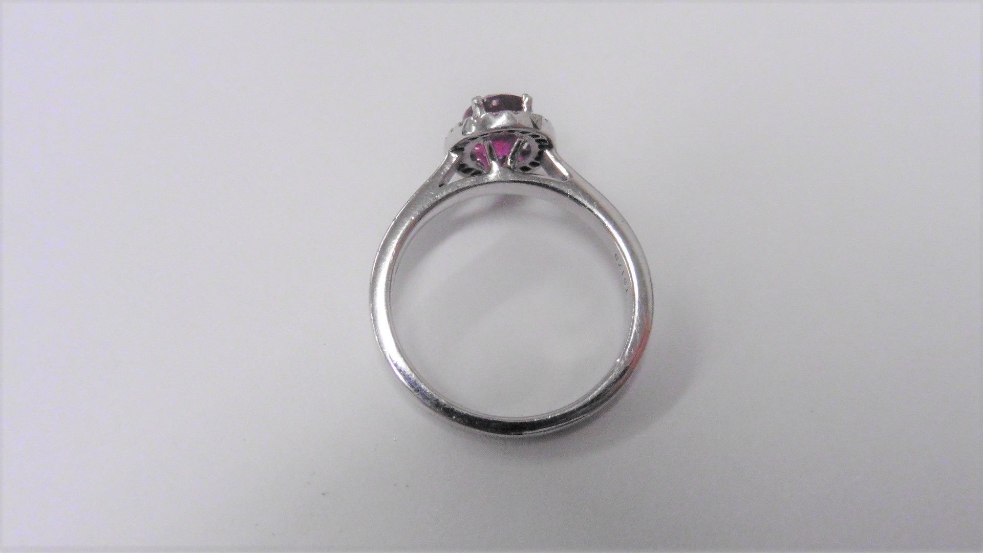 Ruby and Diamond cluster ring set in platinum. Oval cut ruby ( fracture filled ) 1ct, surrounded - Image 2 of 3