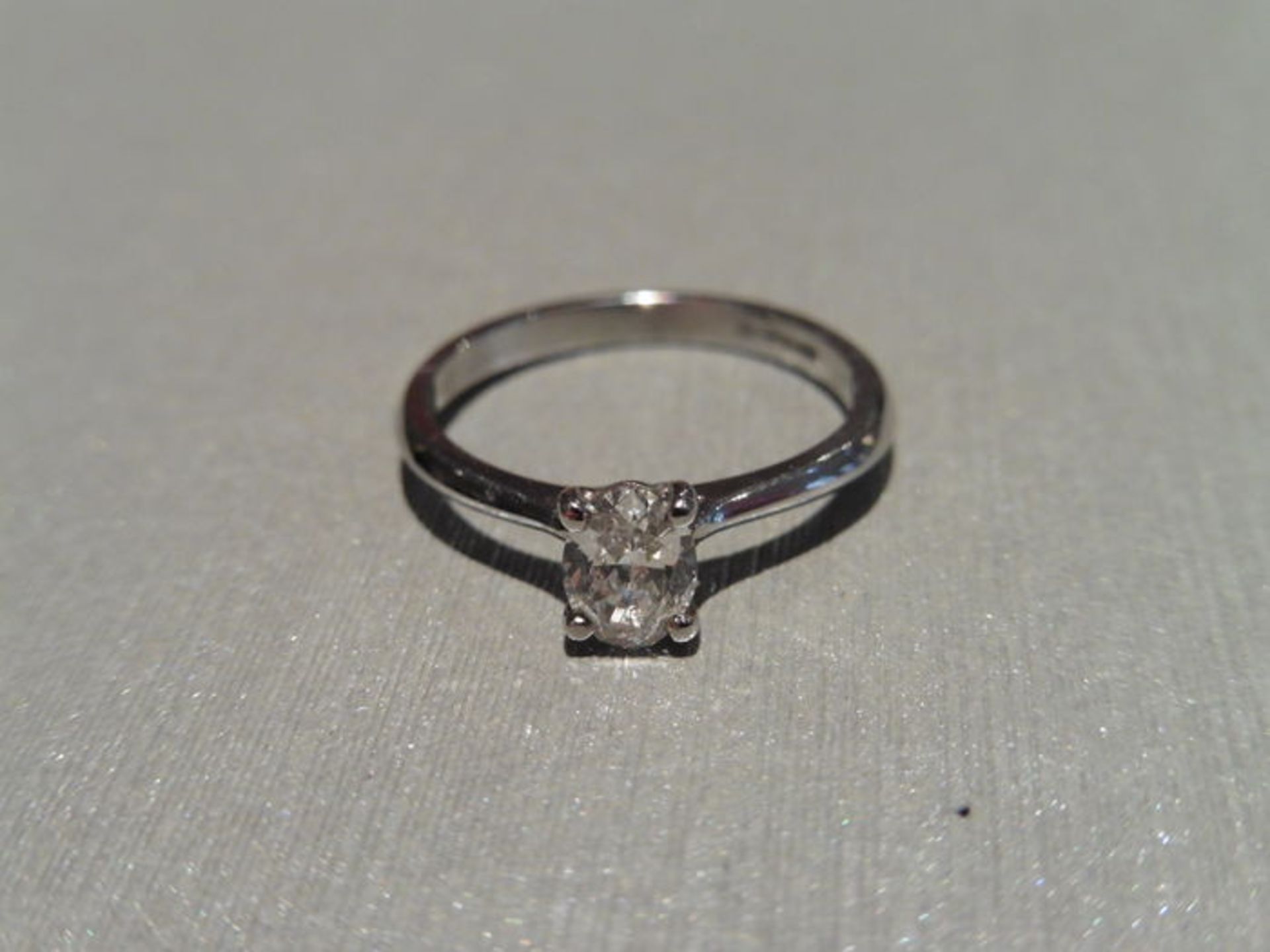 0.34ct diamond solitaire ring set with an oval cut diamond. I colour, si2 clarity. Set in platinum 4