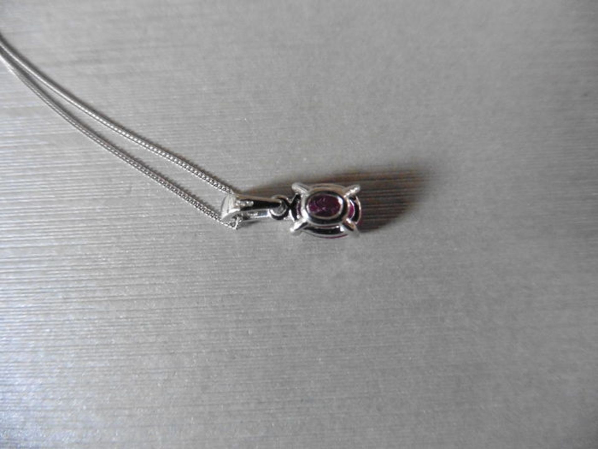 1ct ruby and diamond pendant with an 7x5mm oval cut ruby ( fracture treated ) and a diamond set - Image 2 of 2