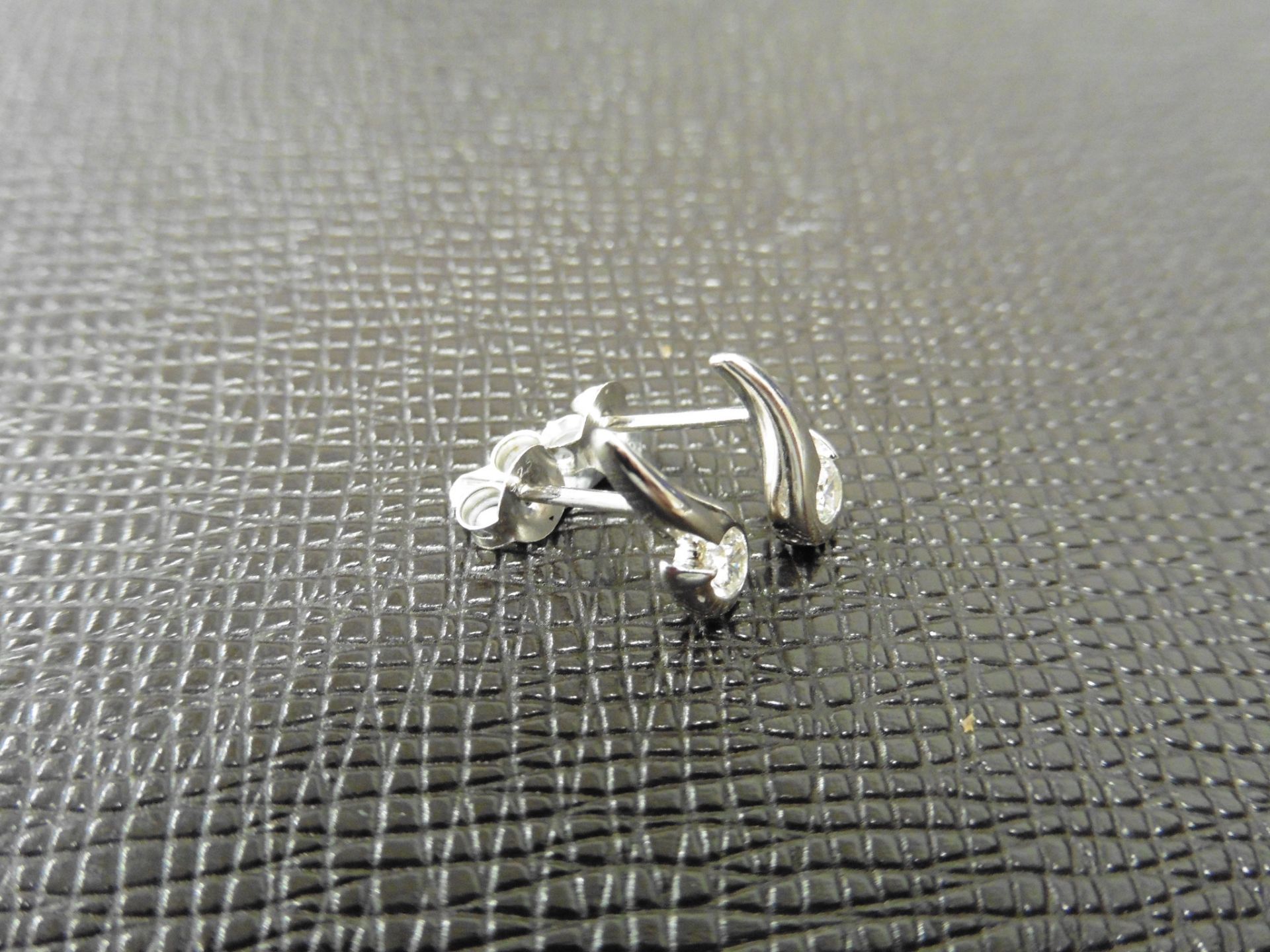 0.20ct diamond swirl style earrings set in platinum 950. 2 small brilliant cut diamonds, H/I - Image 2 of 3