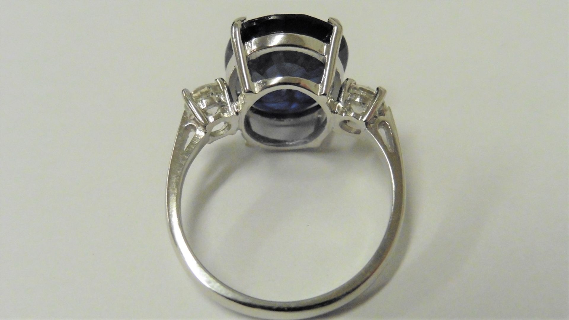 9ct sapphire and diamond trilogy ring set in platinum. Oval cut sapphire ( fracture filled ) with - Image 2 of 3