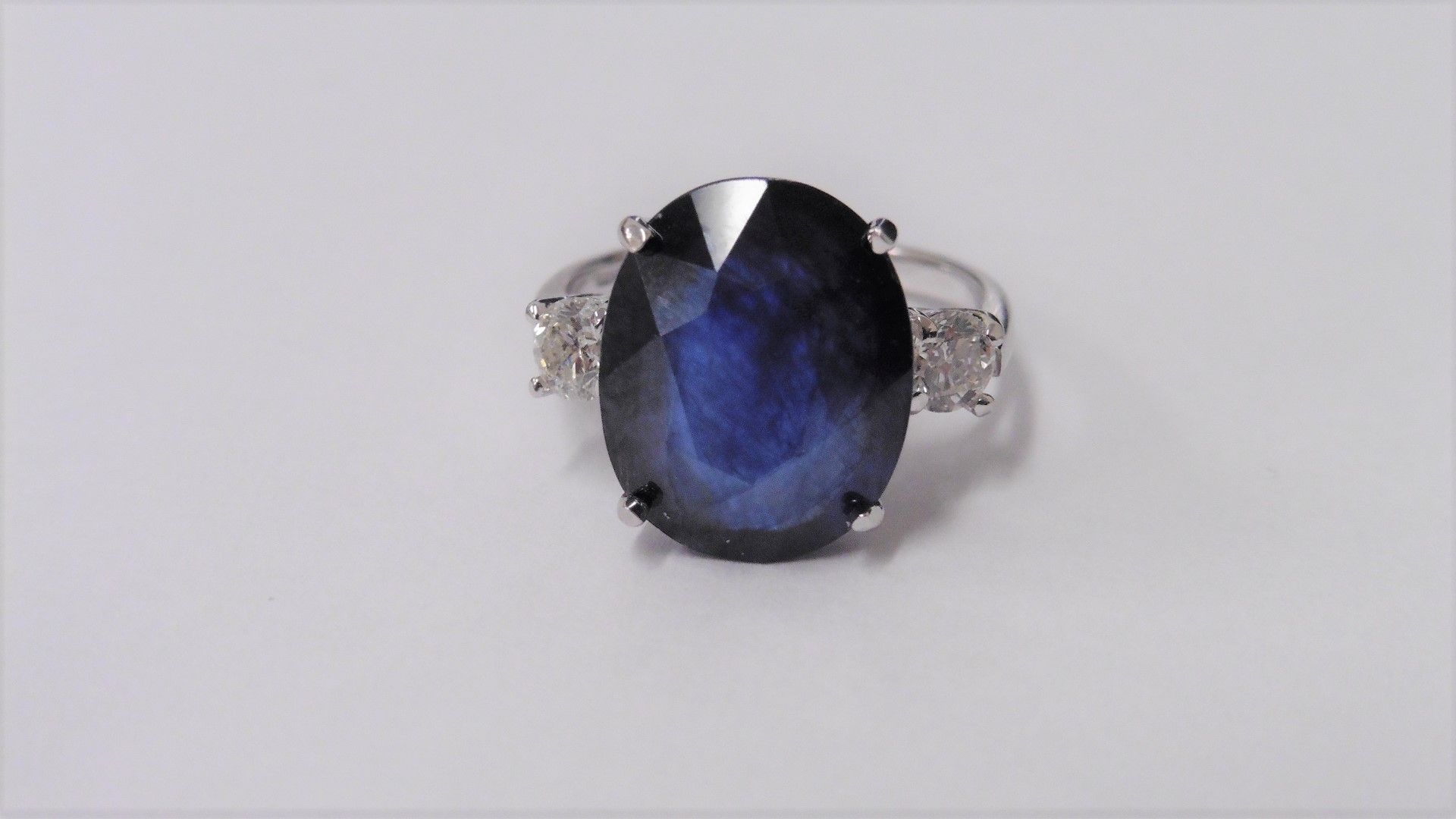 9ct sapphire and diamond trilogy ring set in platinum. Oval cut sapphire ( fracture filled ) with - Image 3 of 3