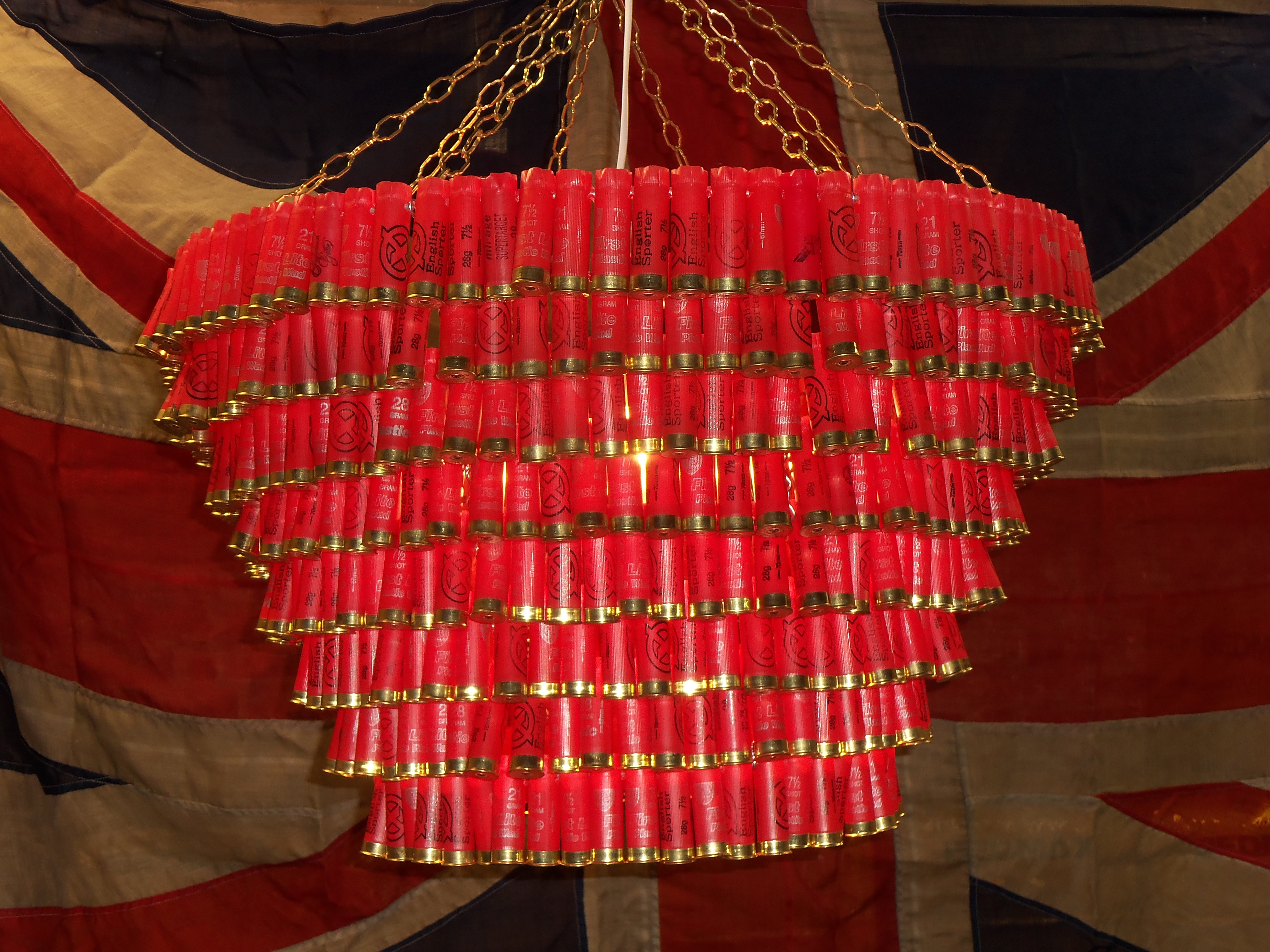 James Day | Red shotgun cartridge chandelier. This is 8 tiers long and approx 70cm wide, handmade