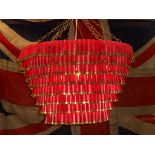 James Day | Red shotgun cartridge chandelier. This is 8 tiers long and approx 70cm wide, handmade
