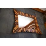 Malcom Lewis | This is a volcanic Swiss jigsaw zebra mirror made from oak and walnut and reserve