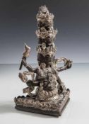 Mahakala-Figur, wohl Tibet 19. Jahrhundert, Bronze, patiniert, partiell versilbert. Sitzende,