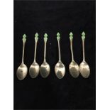 A set of six silver Art Deco demitasse spoons with green enamel