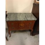 A grey marble topped two drawer commode with ormolu detail and inlay in a French style