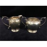 Mappin and Webb silver cream jug and sugar basin, hallmarked London and with original receipt of