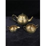 A silver teapot, milk jug and sugar bowl, hallmarked London 1913-14 Total weight 435g