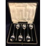 A boxed set of silver teaspoons