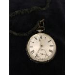 Silver pocket watch on a material chain
