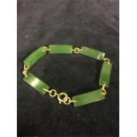 A 9ct gold and jade bracelet