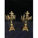 Two sets of gilt Cherub themed cocktail sticks