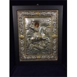 A silver depiction of St George and the Dragon