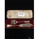 A set of boxed Victorian silver hallmarked fish servers London 1851