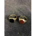 Signet rings in 8ct gold, one set with hexagonal black onyx, the other with an oval carnelian