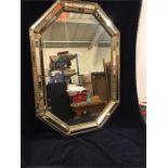 An Italian mirror with mirror tiled frame.