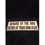 A cast iron beware of the large dog sign