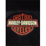 A cast iron Harley Davidson sign