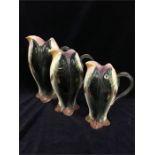 A set of three ceramic Fish jugs