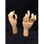 A pair of artist model wooden hands with jointed fingers