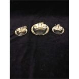Three silver apple pin dishes