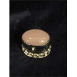 A silver and semi precious stone pill box