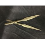 A pair of carved daggers