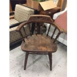 An smokers bow arm chair in oak.