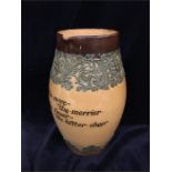 Lambeth Doulton stoneware jug bearing the inscription 'The more the merrier, The fewer the better