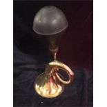 A brass taxi horn