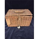 A traveling tea set in a wicker basket