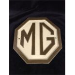 A cast iron MG sign