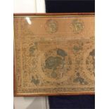 An antique framed Chinese silk with gold embroidery