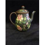 A Wedgwood black teapot with a floral design