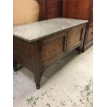 A marble topped oak cabinet