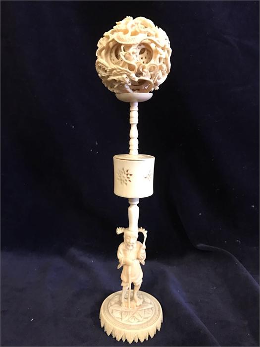 A Ivory puzzle ball on stand