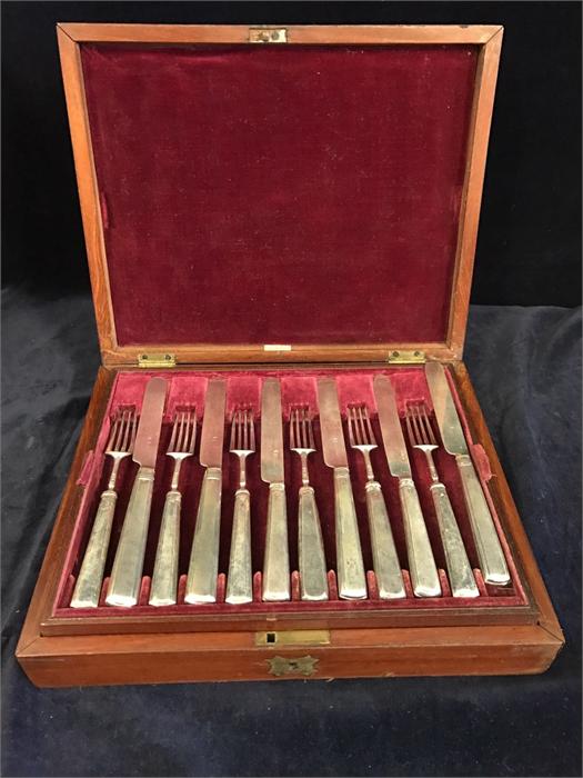 A 24 piece Hallmarked Georgian Silver canteen of cutlery in Mahogany Box