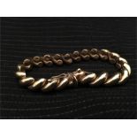 A 9ct gold bracelet, hallmarked and stamped 375 (23.2g)