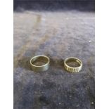 A 18ct gold hallmarked ring (5.5g) and another hallmarked gold wedding ring (6.7g)