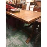 A light oak extending table