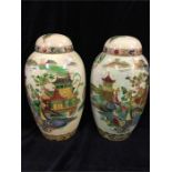 A pair of Carlton Ware Oriental style lidded vases or Ginger Jars circa 1920-1926 (Lids have been