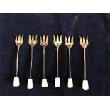 A set of six silver forks