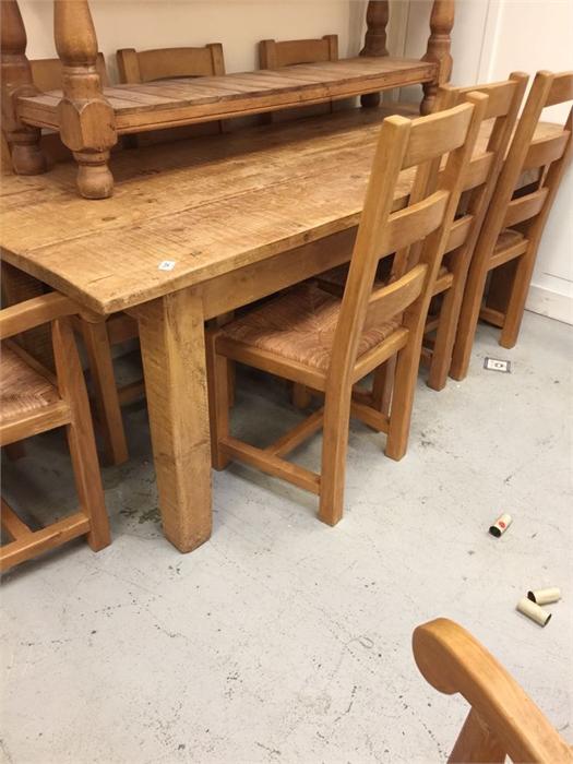 A Pine Dining table with two carvers and six chairs with rush seats 2.15 m x 85cm